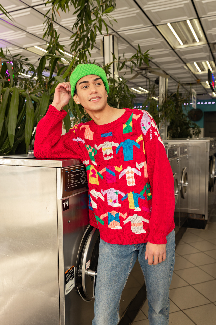 Young Man in Trendy Colorful Outfit at Laundromat